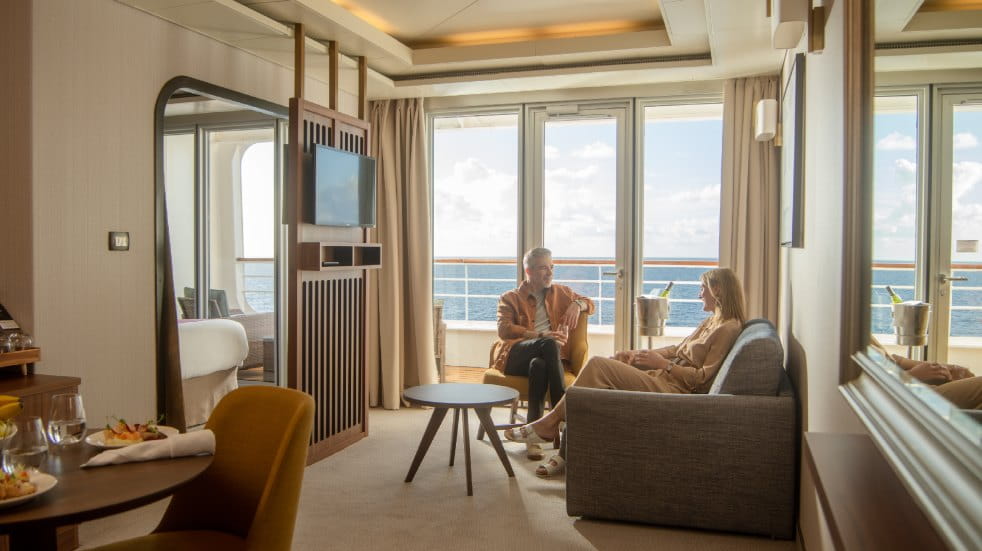 Couple relaxing in an Ambassador suite